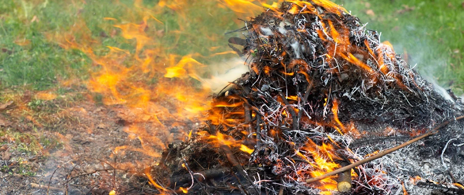 Burning leaf pile causing hazardous conditions in Sioux Falls, SD.