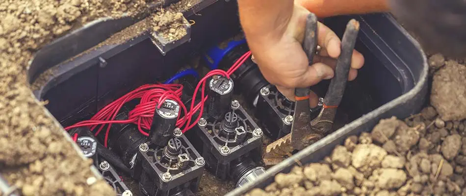 Irrigation professional shutting off system at the control box near Brandon, SD.