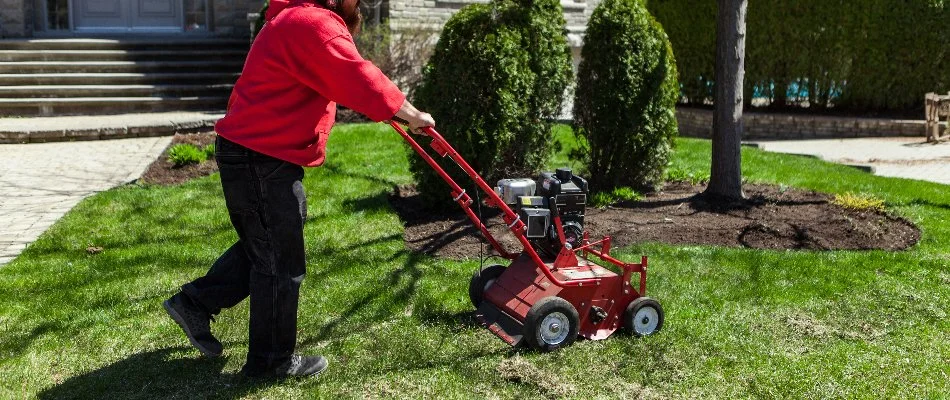 Person Pushing Aerator Machine