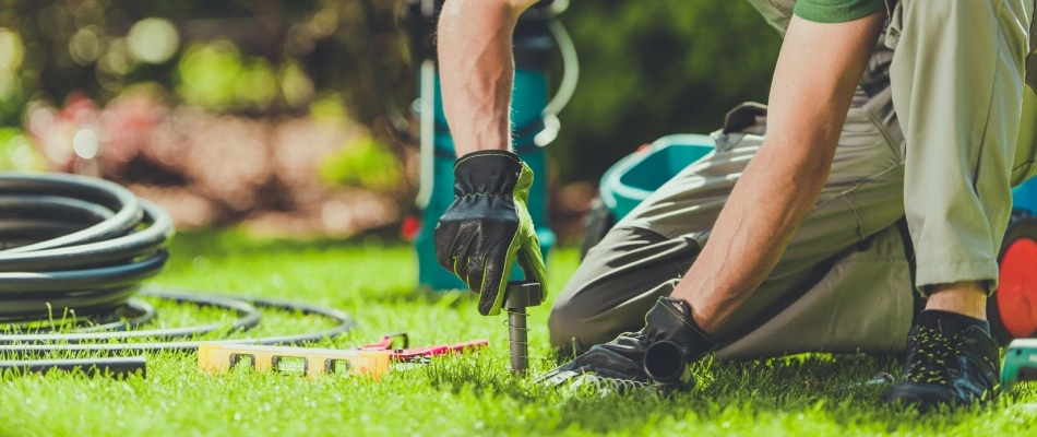 A professional installing an irrigation system in Tea, SD.