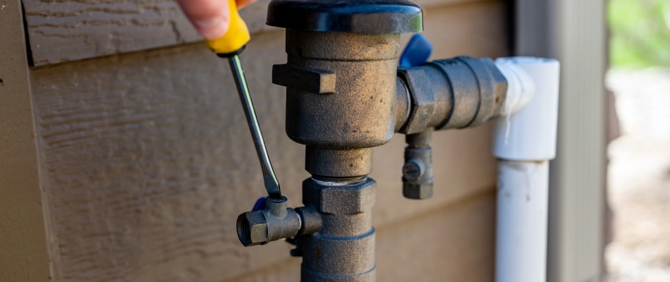 Tech starting irrigation line after winter season in Harrisburg, SD.